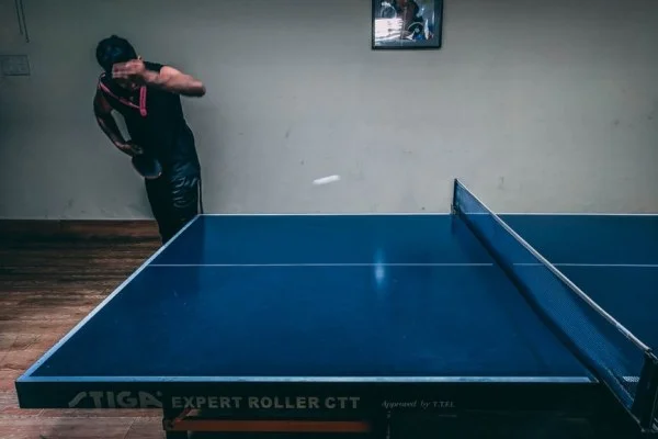 intense table tennis match action